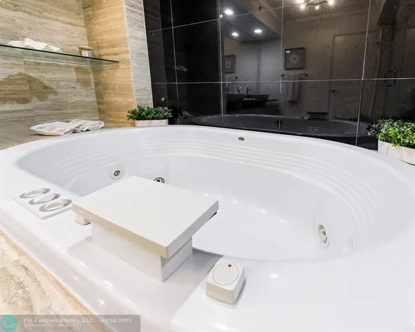 a bathroom with a bathtub and a sink