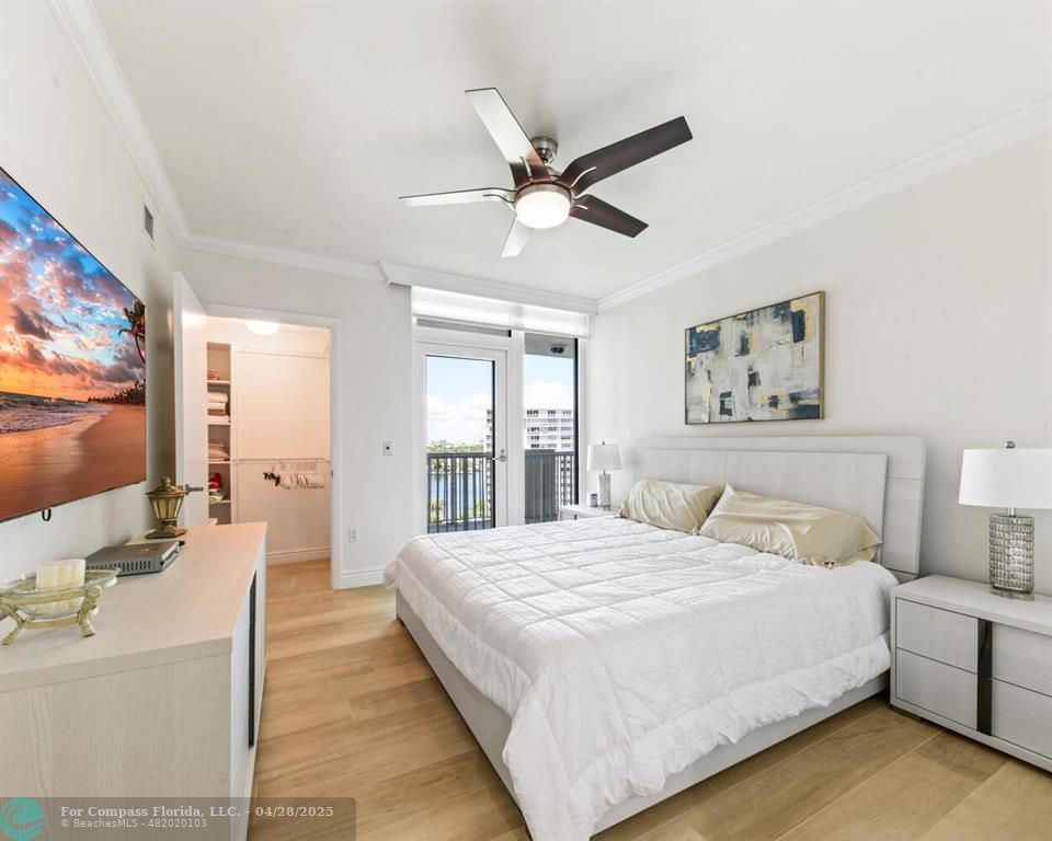 101 South Fort Lauderdale Beach Boulevard, Unit 1104 Fort Lauderdale, FL 33316 - Photo 18 of 41 a bedroom with a large bed and a flat screen tv