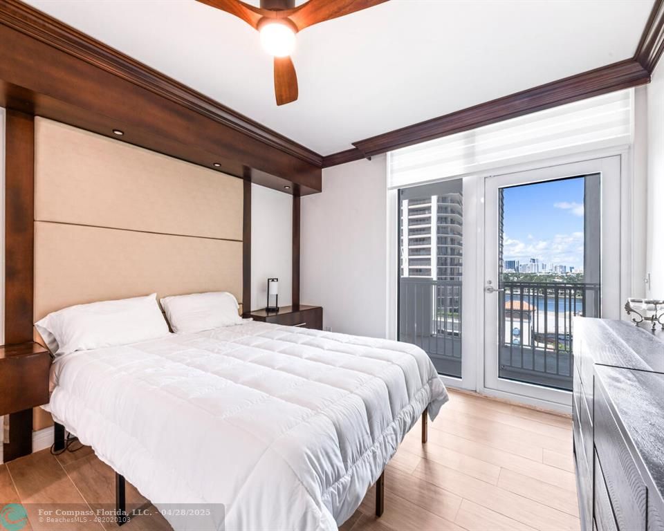 101 South Fort Lauderdale Beach Boulevard, Unit 1104 Fort Lauderdale, FL 33316 - Photo 19 of 41 a bedroom with a large bed and a large window