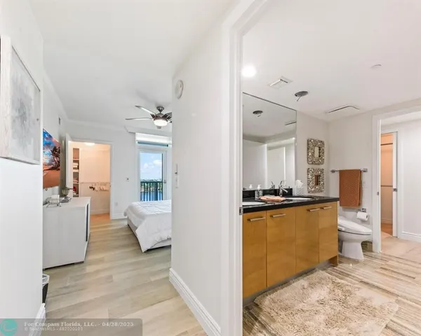 a view of a living room kitchen and a sink