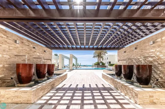 a view of a porch with wooden floor