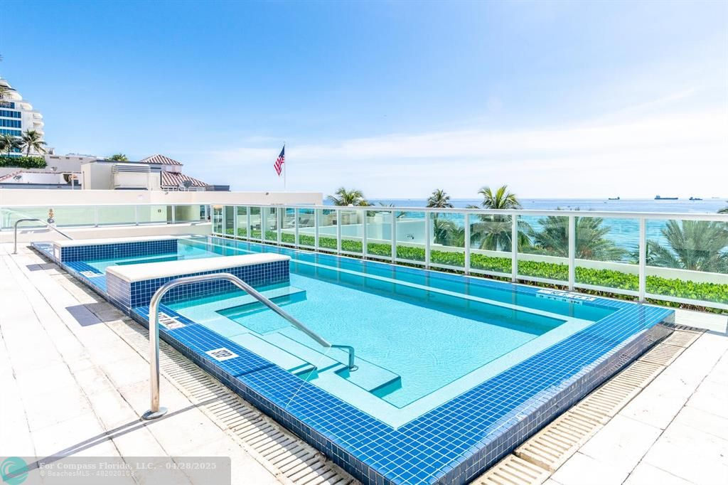 101 South Fort Lauderdale Beach Boulevard, Unit 1104 Fort Lauderdale, FL 33316 - Photo 27 of 41 a view of a tennis court with a large pool