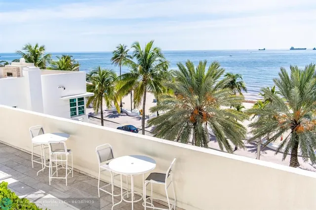 a view of kitchen with dining area and wooden floor