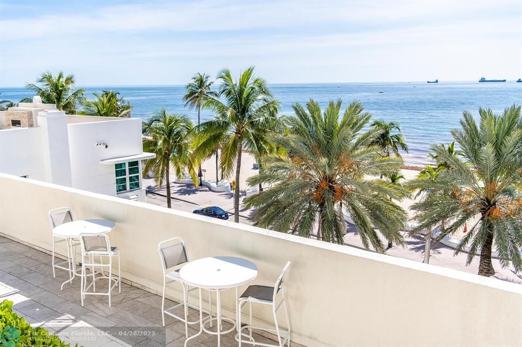 101 South Fort Lauderdale Beach Boulevard, Unit 1104 Fort Lauderdale, FL 33316 - Photo 36 of 41 a view of yard with outdoor seating and mountain view