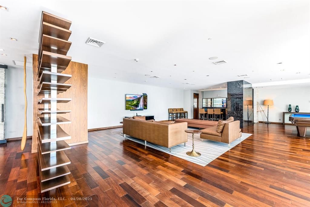 101 South Fort Lauderdale Beach Boulevard, Unit 1104 Fort Lauderdale, FL 33316 - Photo 38 of 41 a living room with furniture and a rug