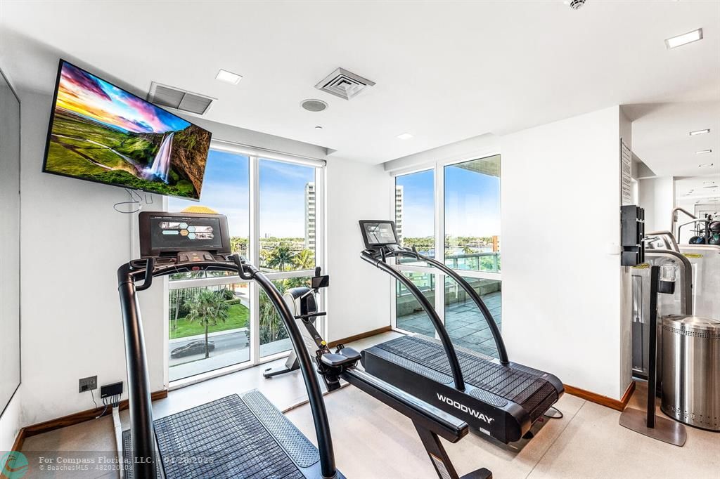 101 South Fort Lauderdale Beach Boulevard, Unit 1104 Fort Lauderdale, FL 33316 - Photo 40 of 41 a room with gym equipment and windows