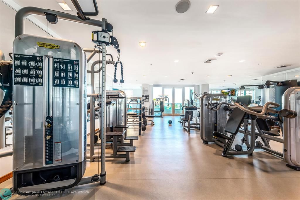 101 South Fort Lauderdale Beach Boulevard, Unit 1104 Fort Lauderdale, FL 33316 - Photo 41 of 41 a view of a room with lots of gym equipment