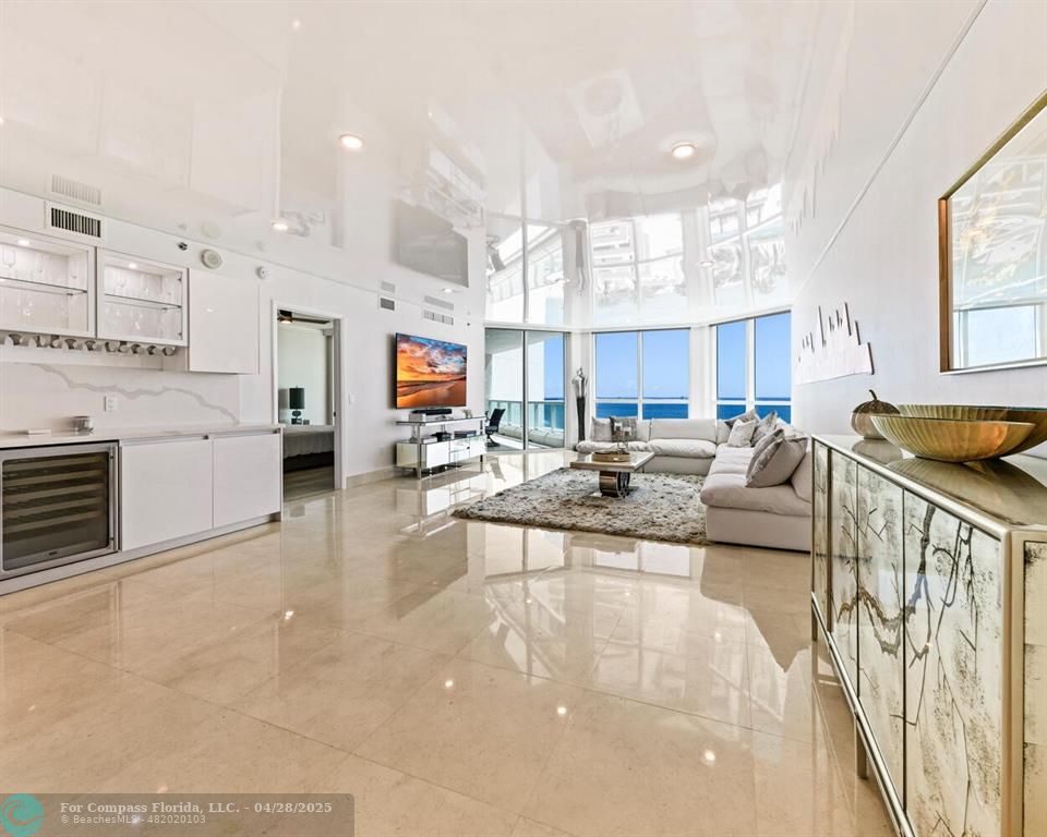 101 South Fort Lauderdale Beach Boulevard, Unit 1104 Fort Lauderdale, FL 33316 - Photo 6 of 41 a living room with furniture and a large window