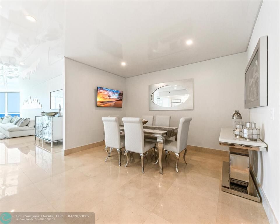 101 South Fort Lauderdale Beach Boulevard, Unit 1104 Fort Lauderdale, FL 33316 - Photo 10 of 41 a view of a dining room with furniture