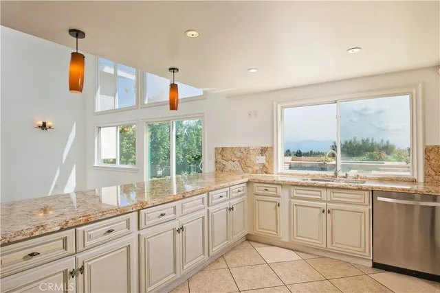 a room with wooden floor a ceiling fan and windows
