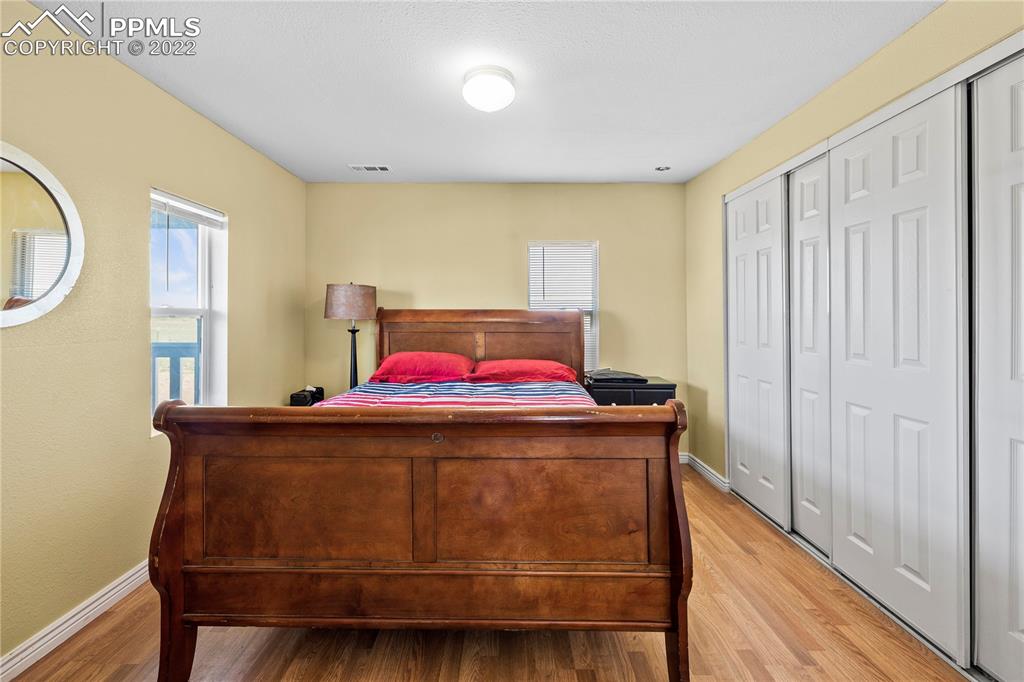5025 Lauppe Road Yoder, CO 80864 - Photo 16 of 50 a bedroom with a bed and a dresser