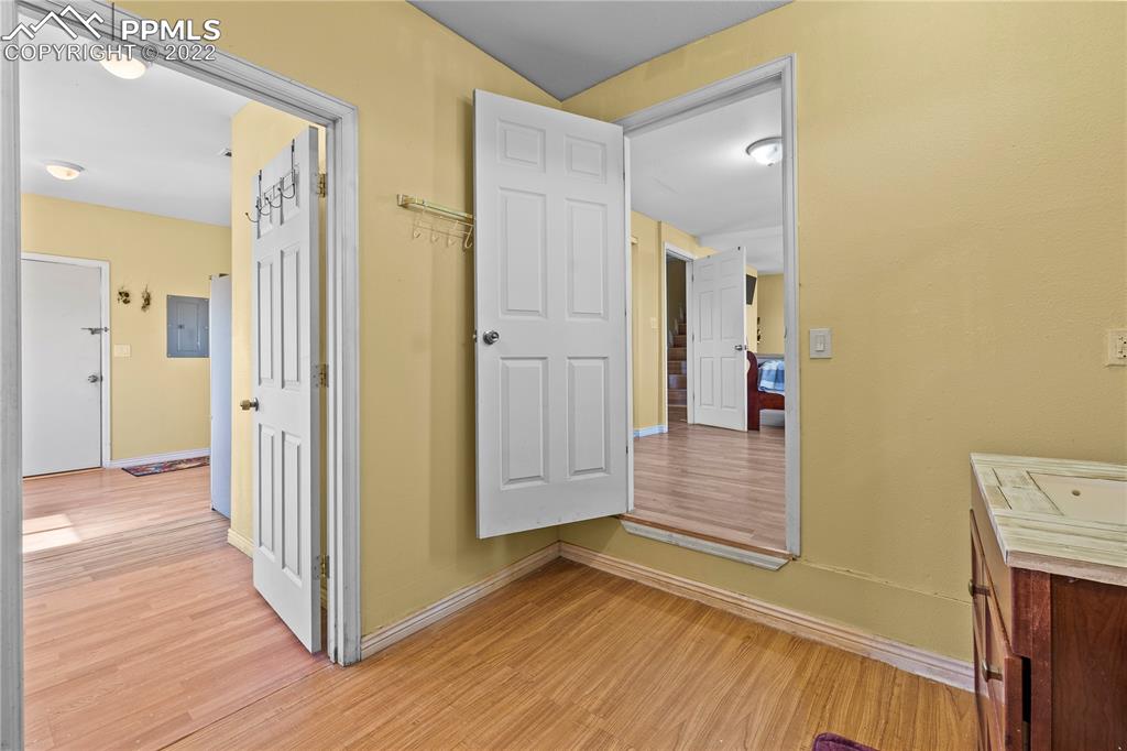 5025 Lauppe Road Yoder, CO 80864 - Photo 19 of 50 a view of a hallway with wooden floor