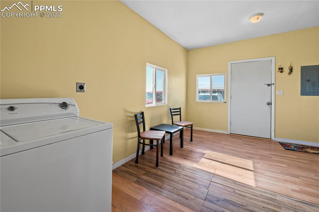 5025 Lauppe Road Yoder, CO 80864 - Photo 22 of 50 a view of a livingroom with furniture and wooden floor