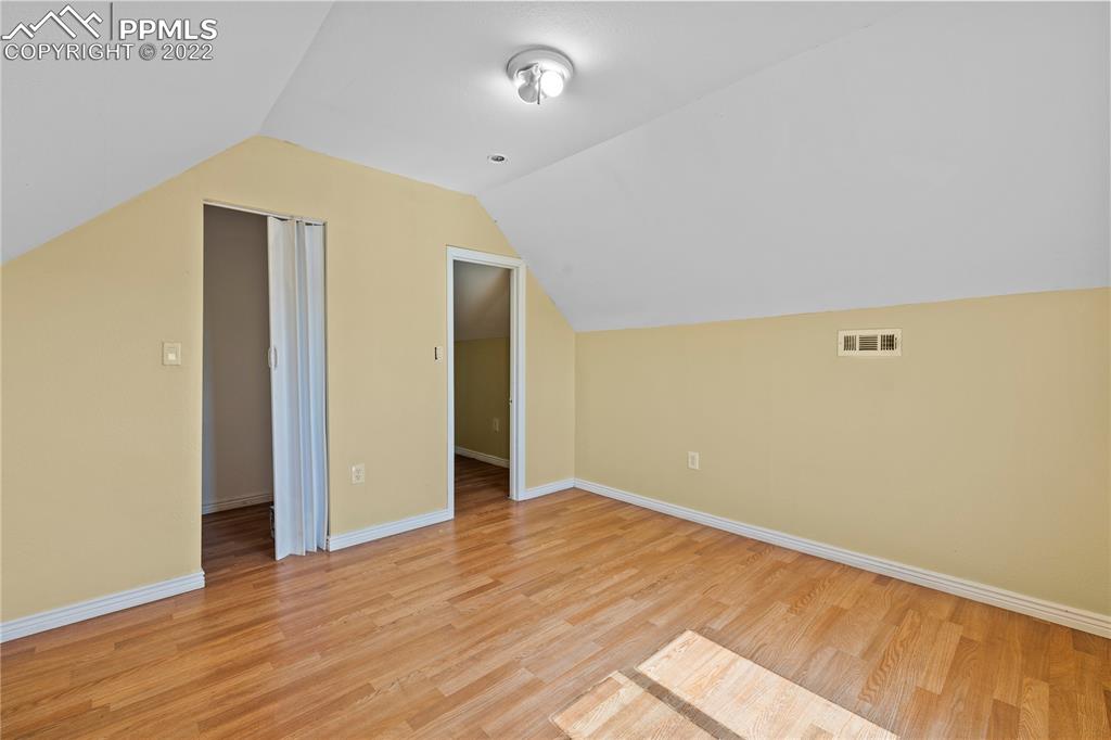 5025 Lauppe Road Yoder, CO 80864 - Photo 25 of 50 an empty room with wooden floor and closet