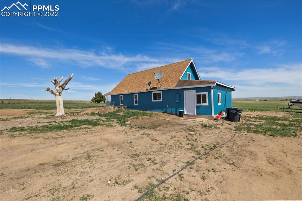 5025 Lauppe Road Yoder, CO 80864 - Photo 31 of 50 a front view of a house with a ocean view