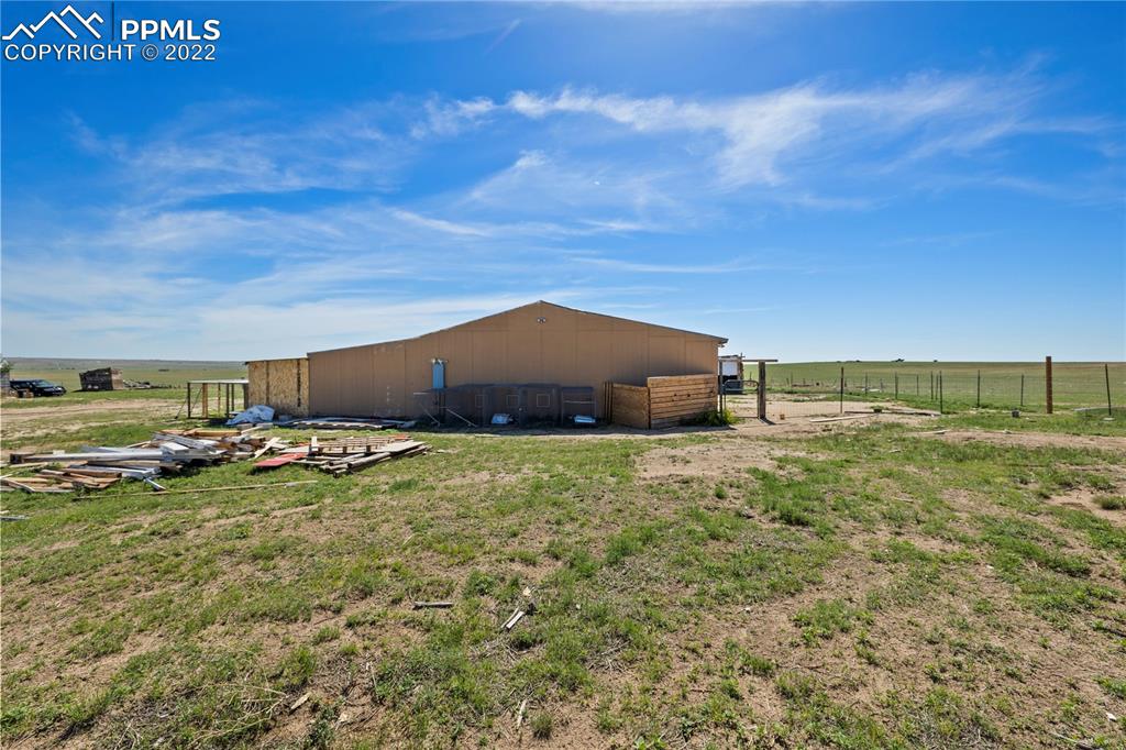 5025 Lauppe Road Yoder, CO 80864 - Photo 33 of 50 a view of a house with a yard