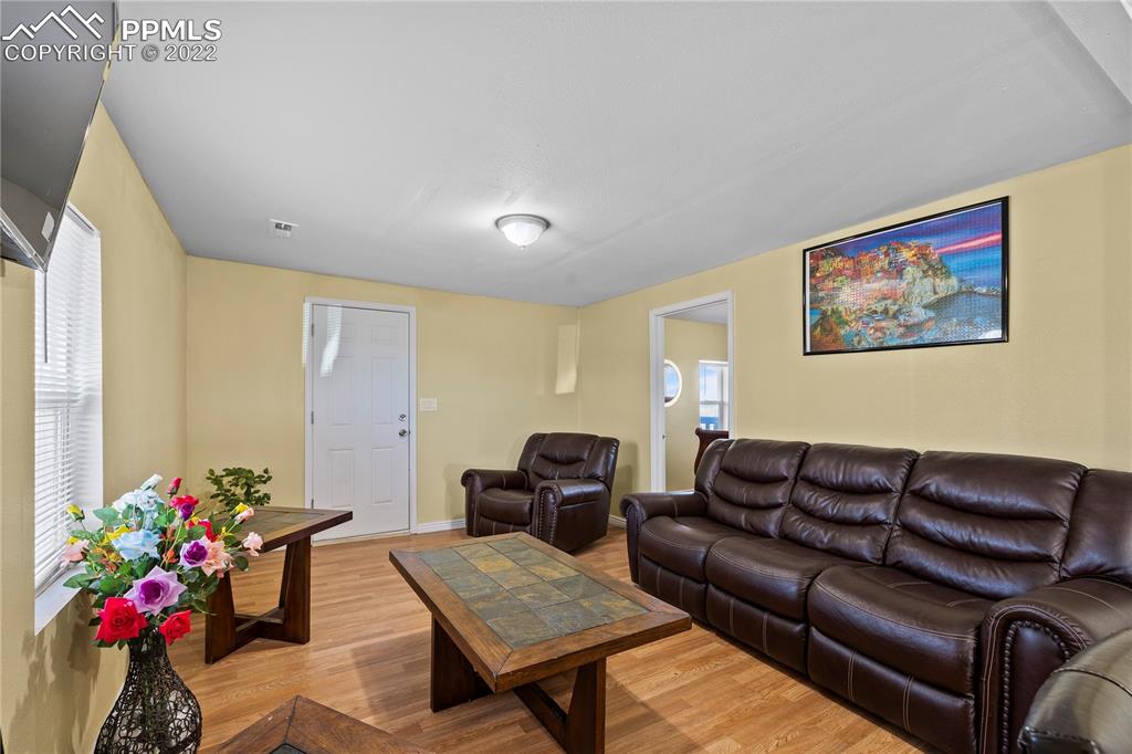 5025 Lauppe Road Yoder, CO 80864 - Photo 4 of 50 a living room with furniture and flowers