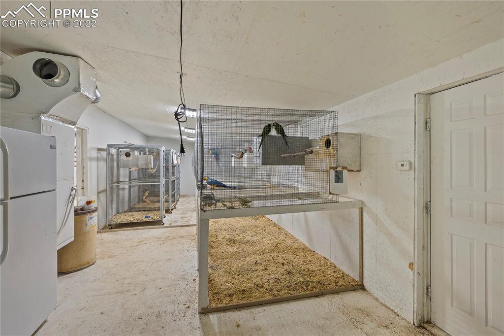 5025 Lauppe Road Yoder, CO 80864 - Photo 45 of 50 a view of a kitchen with refrigerator and car