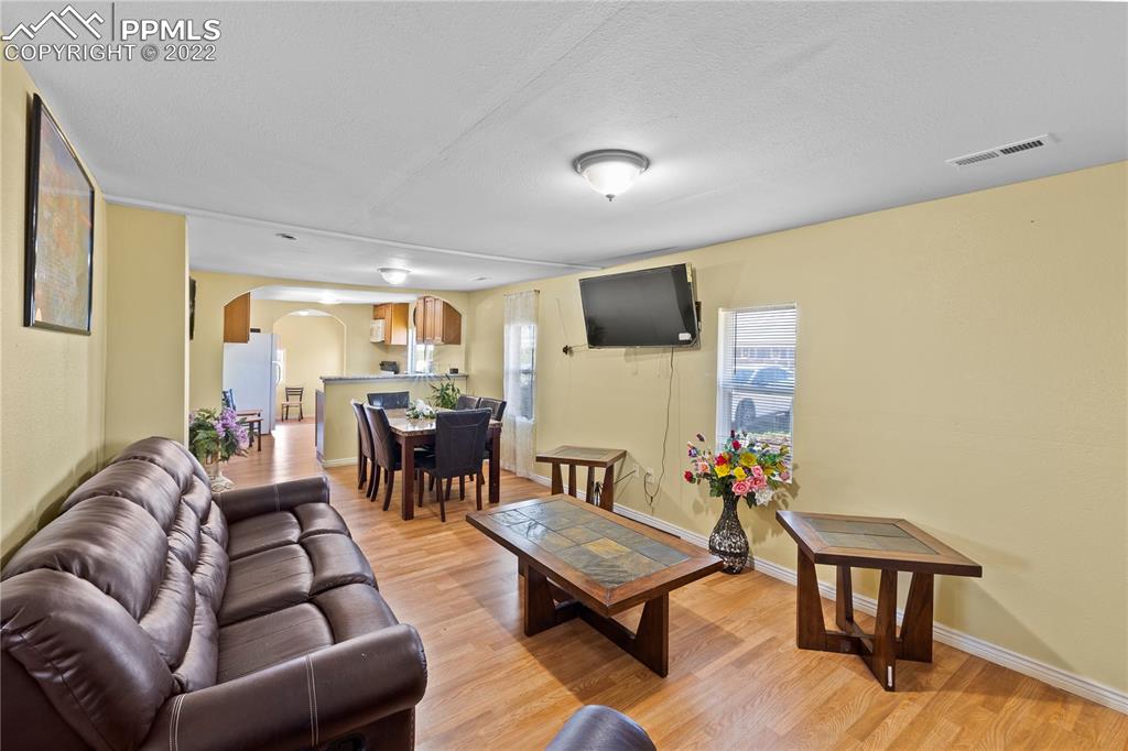 5025 Lauppe Road Yoder, CO 80864 - Photo 6 of 50 a living room with furniture and a table