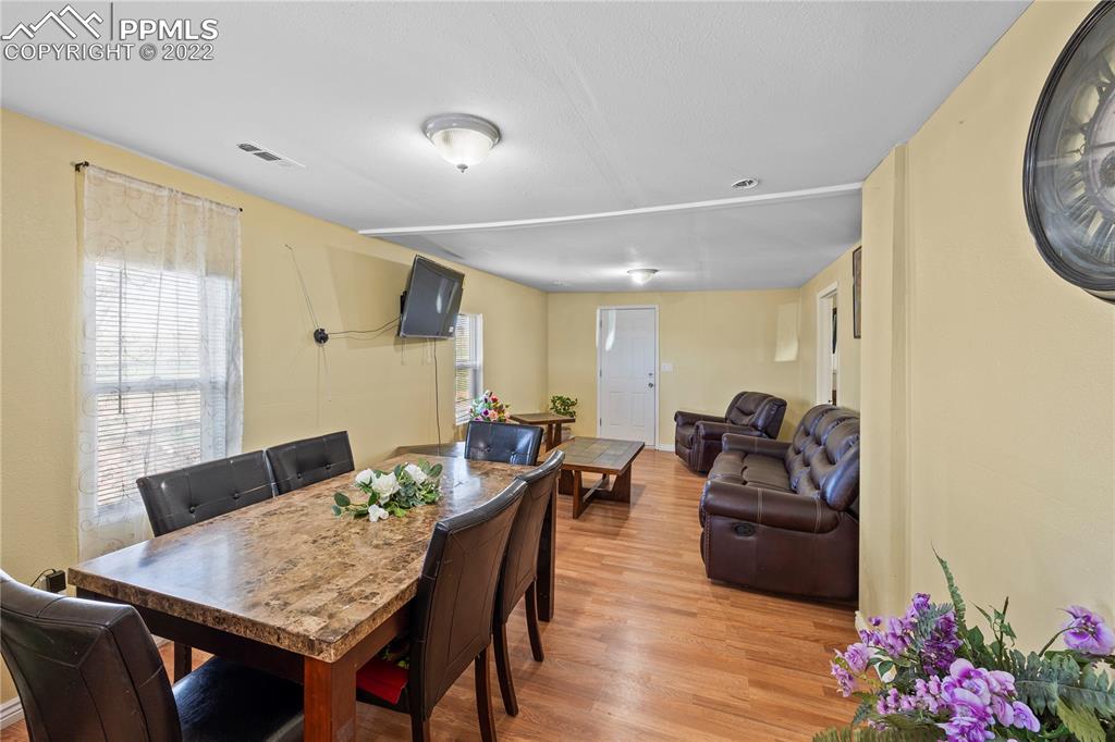 5025 Lauppe Road Yoder, CO 80864 - Photo 8 of 50 a living room with furniture and wooden floor