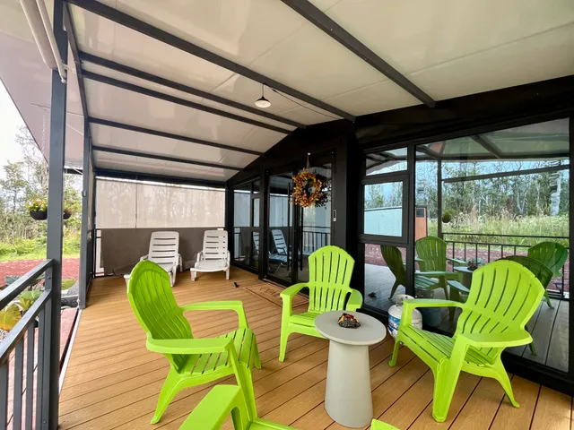 a living room filled with furniture and a table