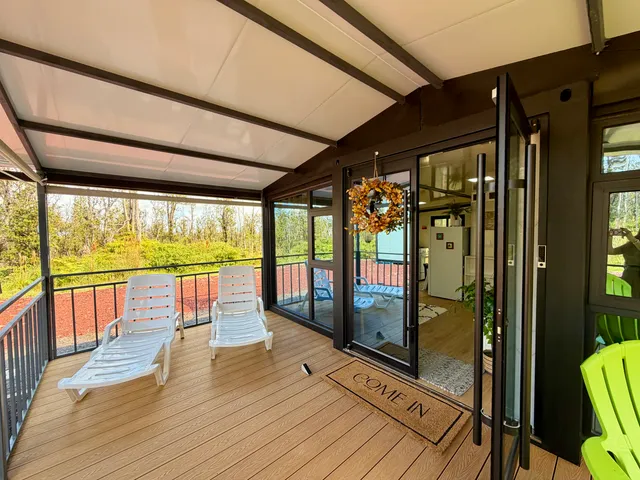 a view of a balcony with wooden floor