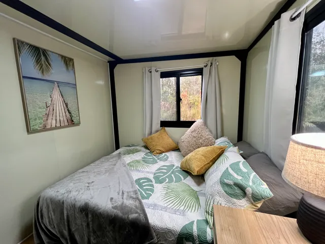 a bedroom with a bed and window