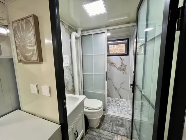 a bathroom with a toilet and shower