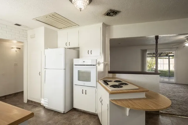 a spacious bathroom with double sink and a mirror