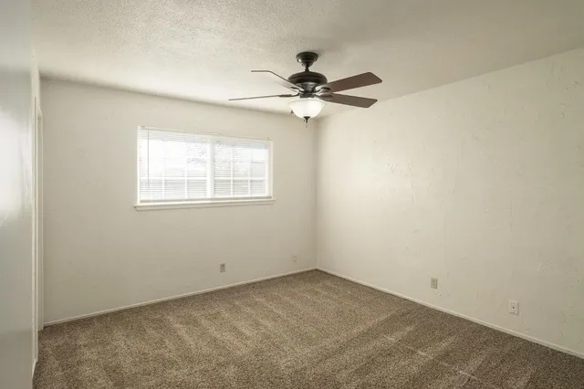 a bathroom with a toilet sink vanity and mirror