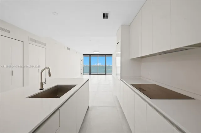 a view of an empty room with glass door