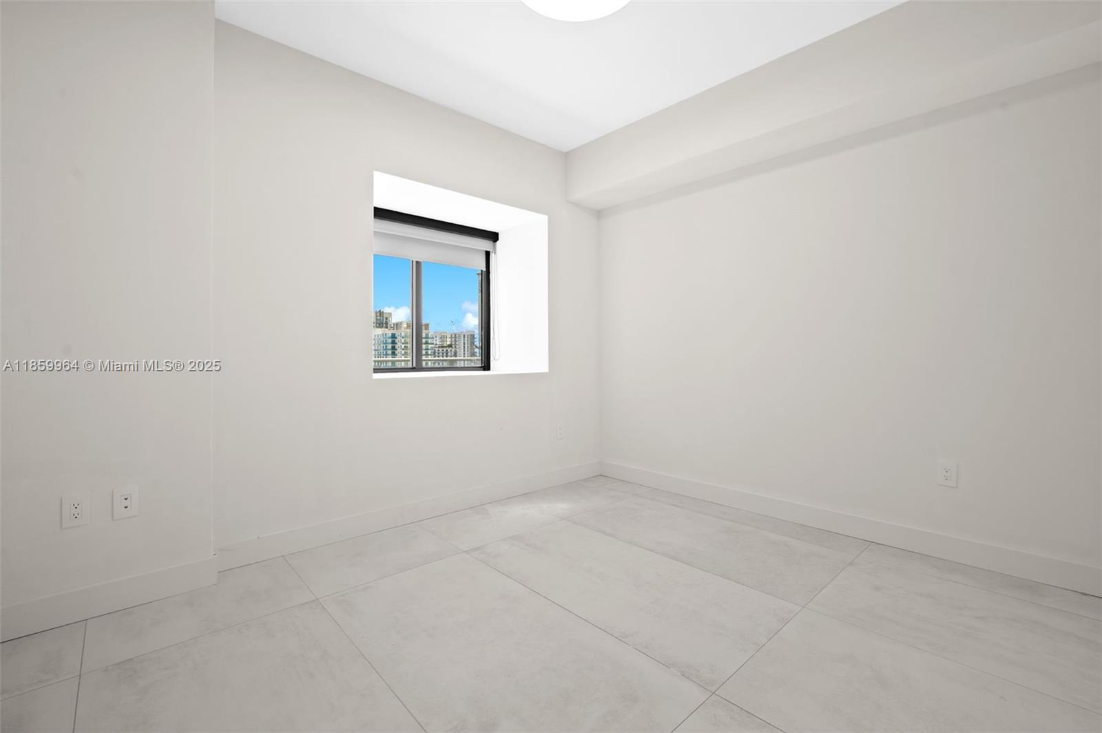 700 Northeast 24th Street, Unit 1406 Miami, FL 33137 - Photo 22 of 55 an empty room with a window