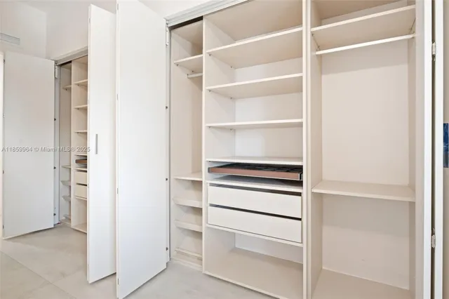 a bathroom with a shower a sink and a toilet