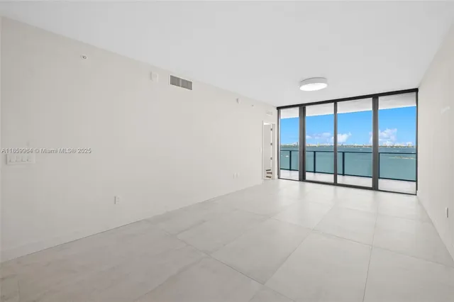 a kitchen with kitchen island a sink and stainless steel appliances