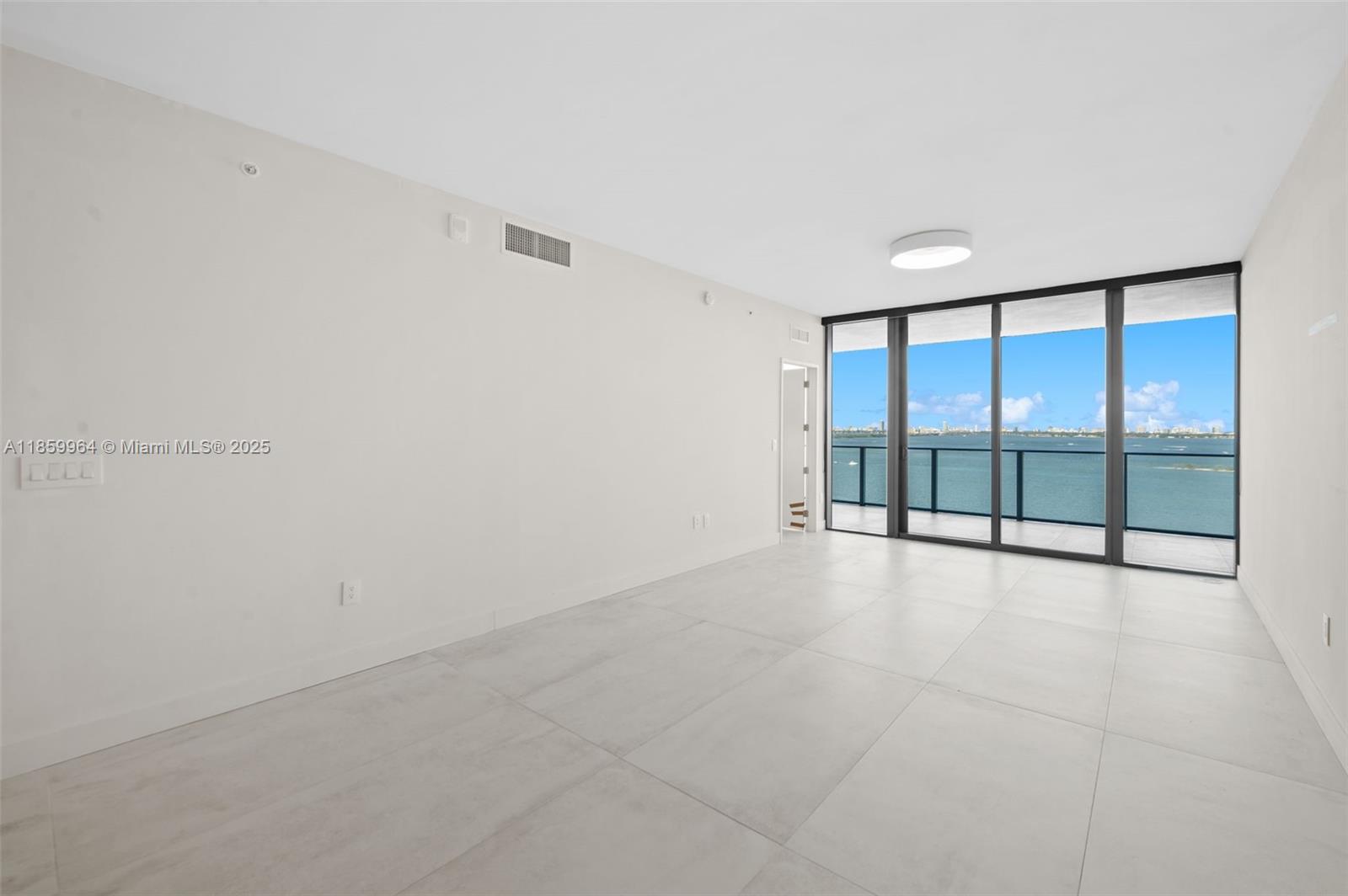 700 Northeast 24th Street, Unit 1406 Miami, FL 33137 - Photo 8 of 55 a view of an empty room with a window