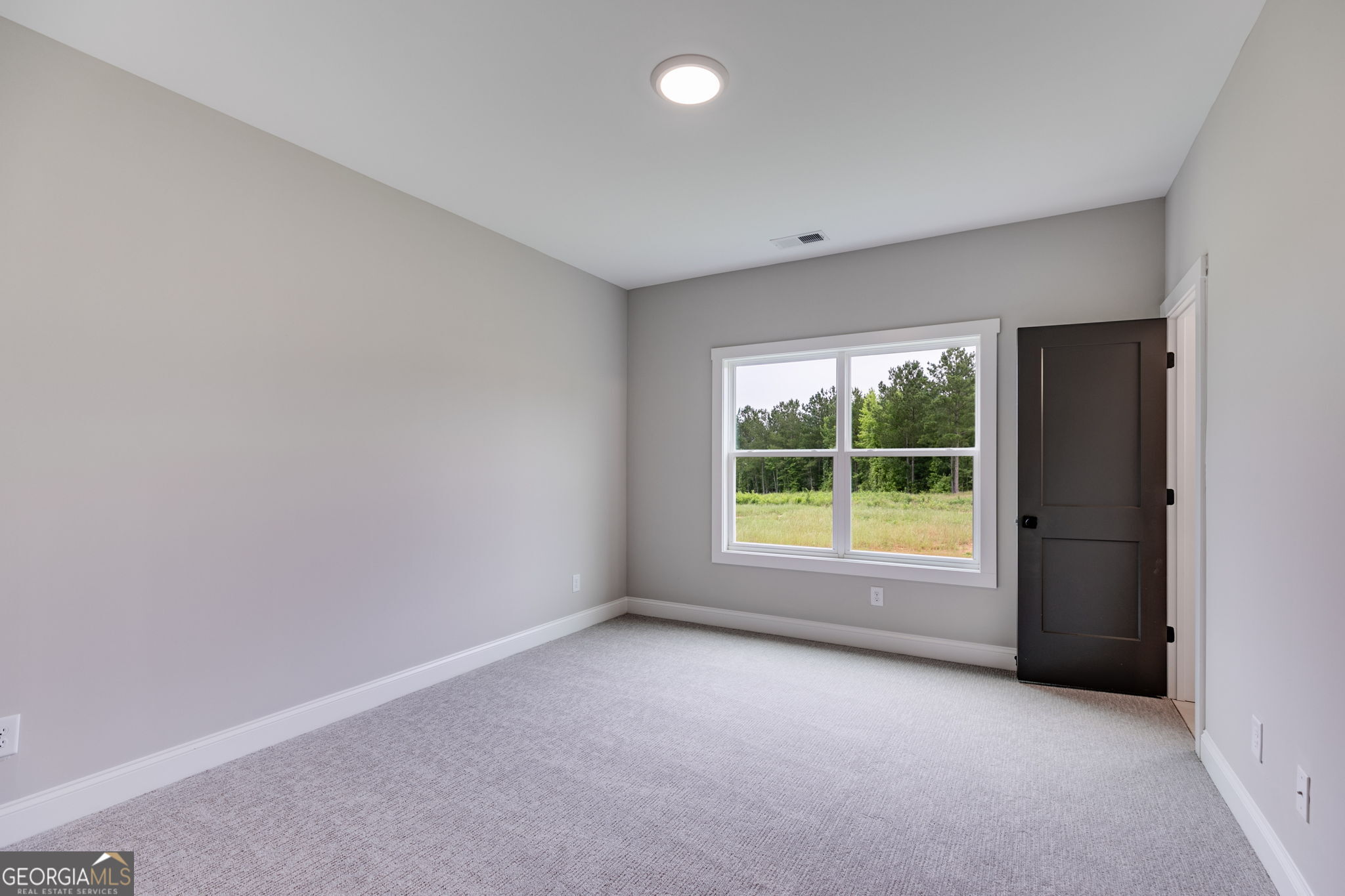 1611 Bethesda Church Road Carrollton, GA 30117 - Photo 28 of 45 an empty room with large windows