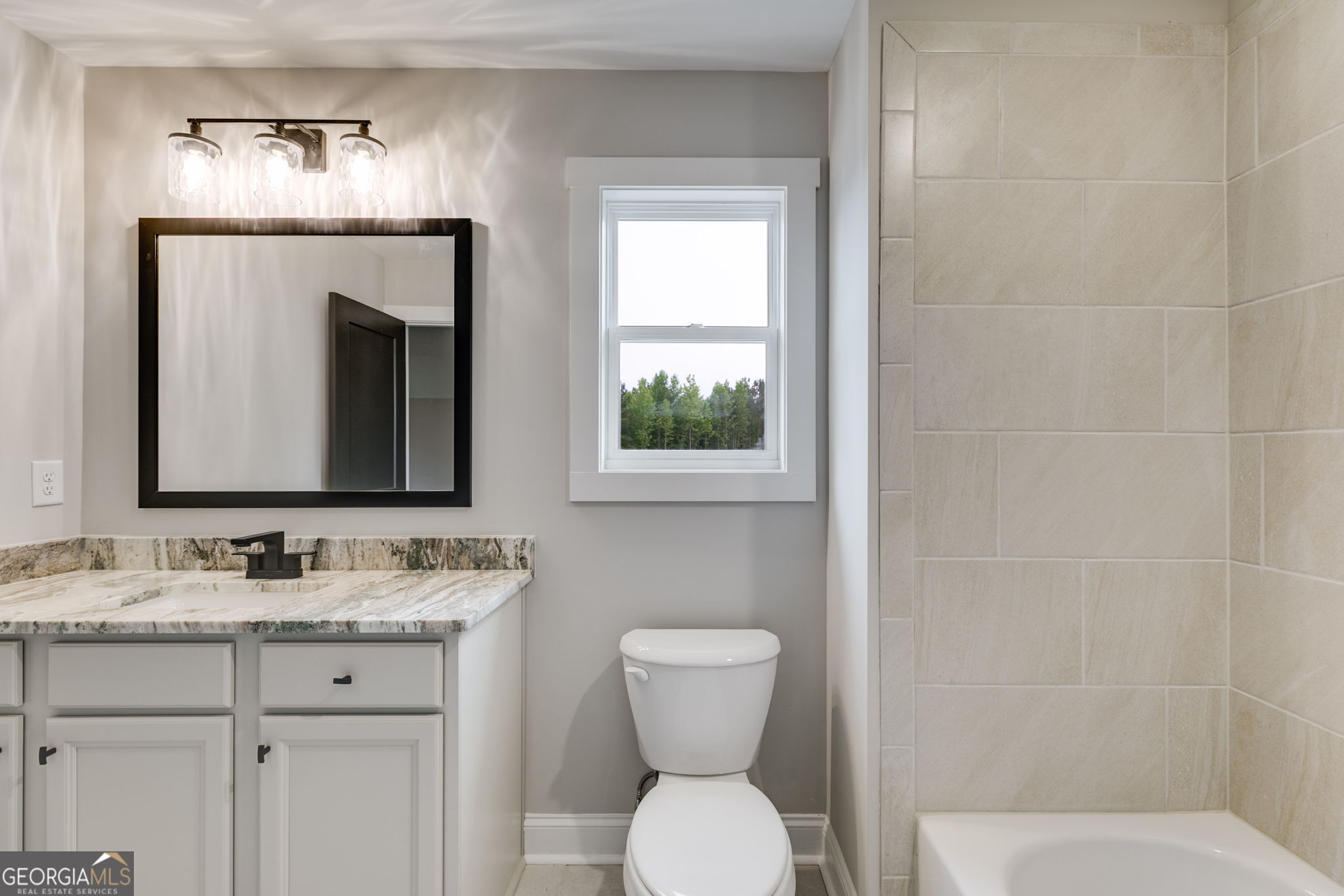 1611 Bethesda Church Road Carrollton, GA 30117 - Photo 33 of 45 a bathroom with a toilet sink and mirror