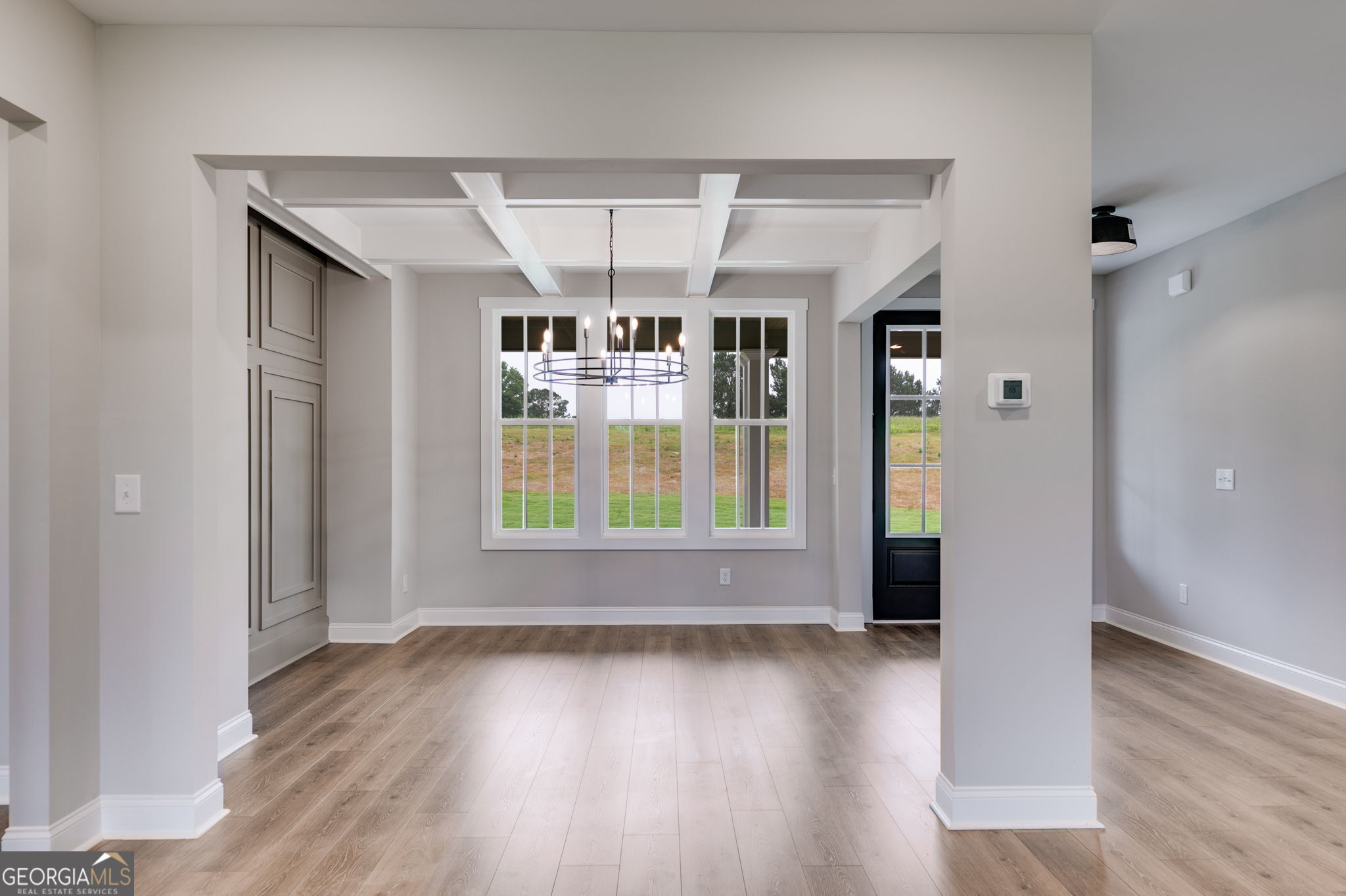 1611 Bethesda Church Road Carrollton, GA 30117 - Photo 9 of 45 an empty room with wooden floor and windows