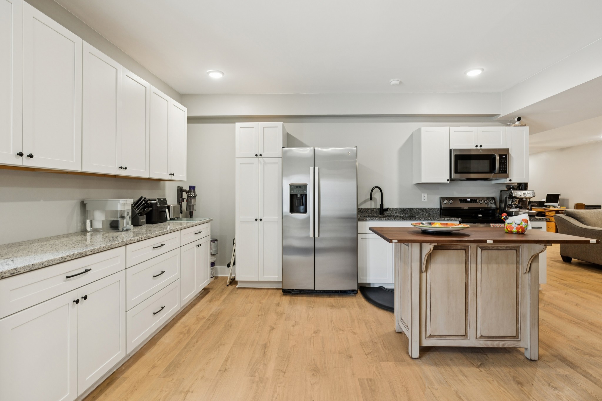 417 Defeated Creek Highway Carthage, TN 37030 - Photo 19 of 31 a kitchen with stainless steel appliances granite countertop a refrigerator and a stove top oven