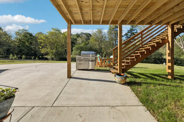 a view of swimming pool with a patio