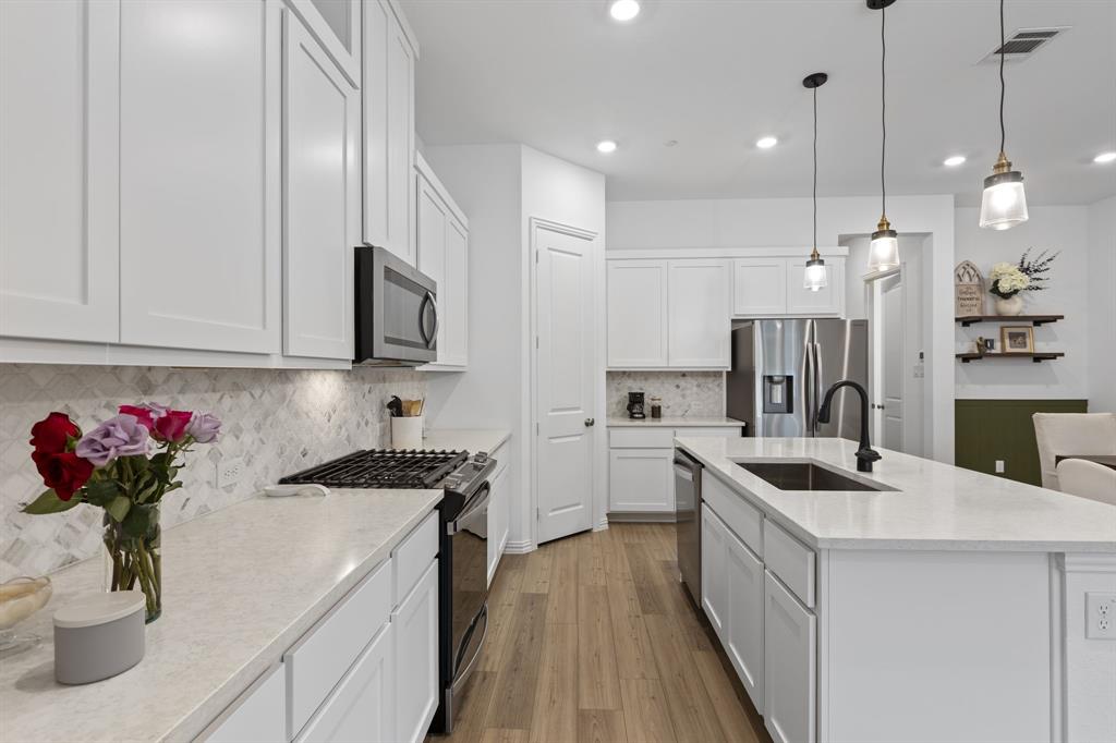 3014 Opera Way Sachse, TX 75048 - Photo 15 of 34 There's even a nice coffee bar area next to the refrigerator.