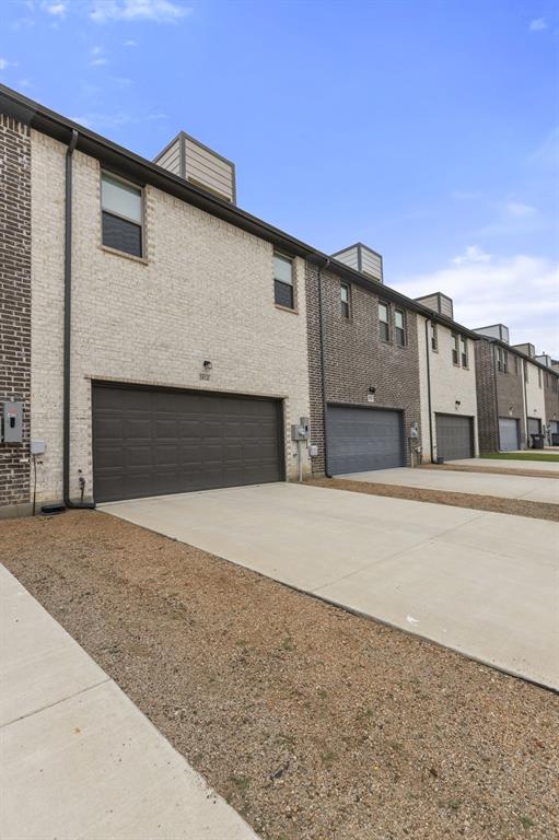 3014 Opera Way Sachse, TX 75048 - Photo 33 of 34 Alley access to the garage with ample driveway space.