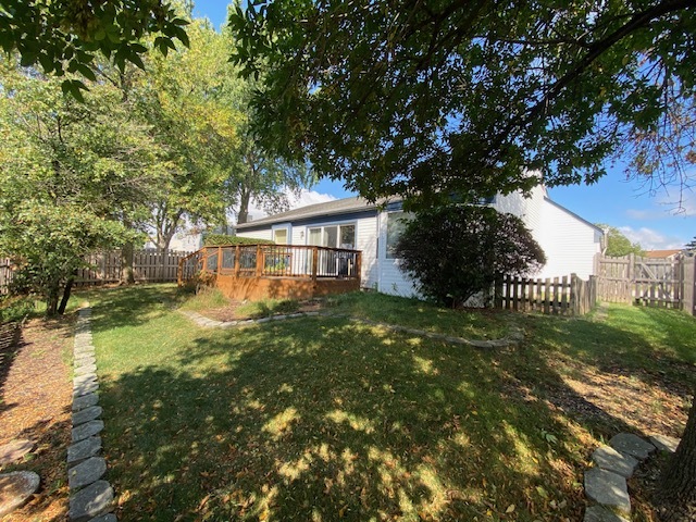 655 Equestrian Drive Wheeling, IL 60090 - Photo 2 of 3 a front view of a house with a yard