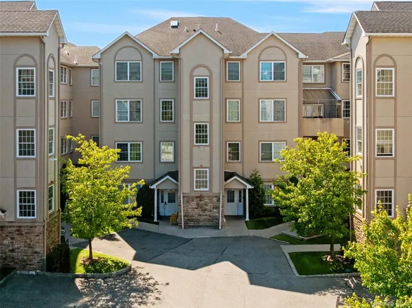 a front view of a multi story residential apartment building