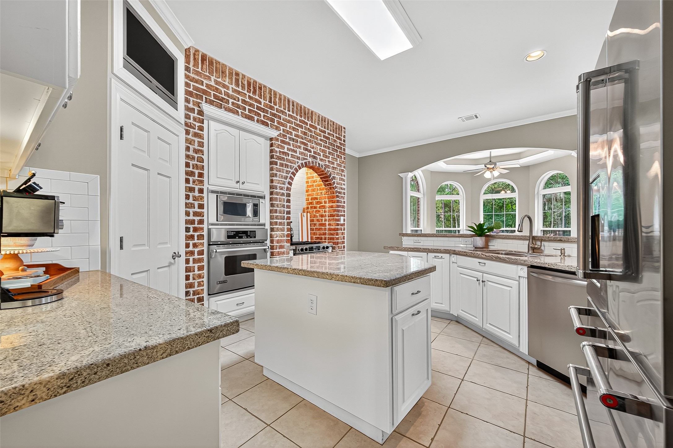 32819 Whitburn Trail Fulshear, TX 77441 - Photo 11 of 49 a kitchen with stainless steel appliances granite countertop a sink and a stove