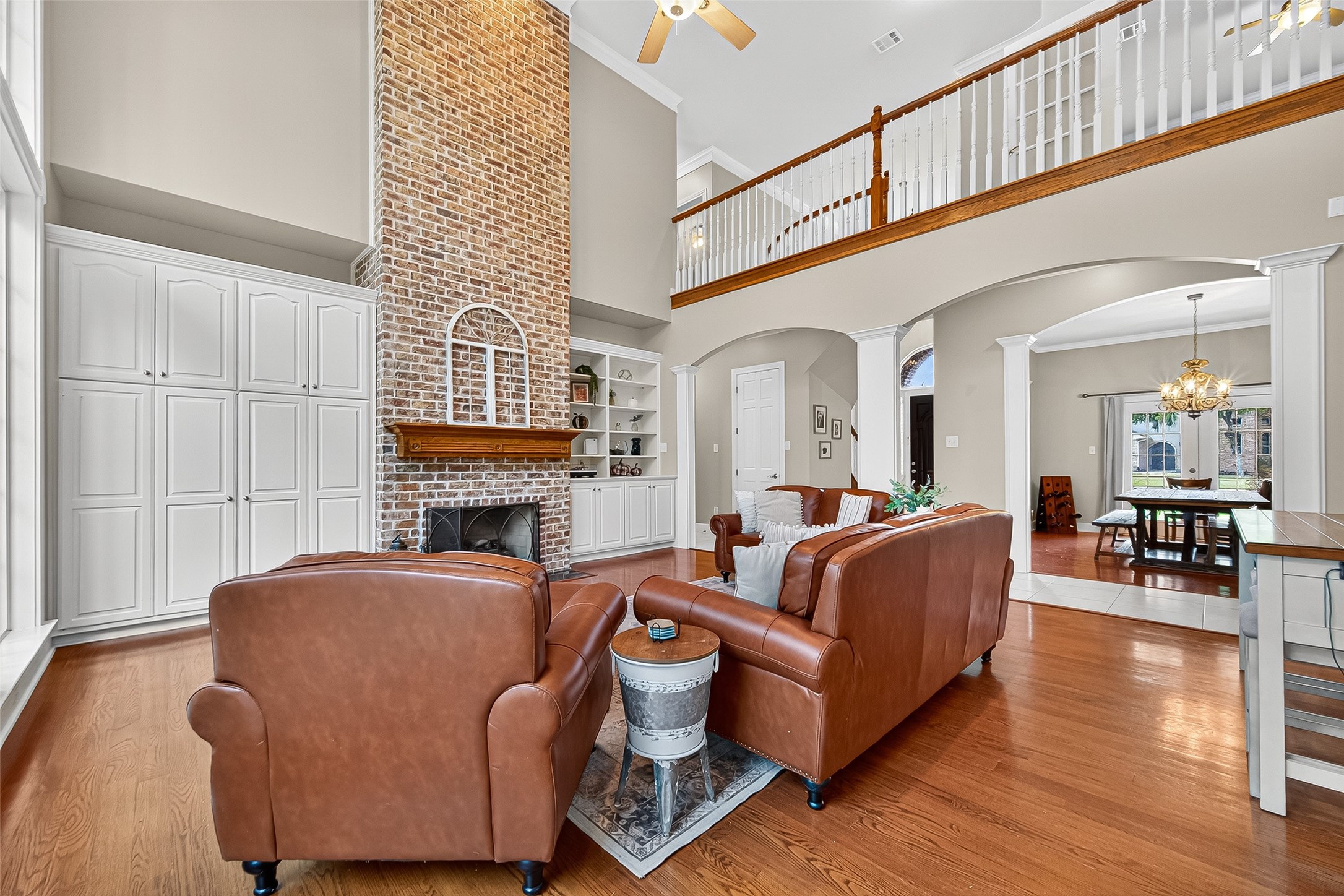 32819 Whitburn Trail Fulshear, TX 77441 - Photo 16 of 49 a living room with fireplace furniture and a wooden floor