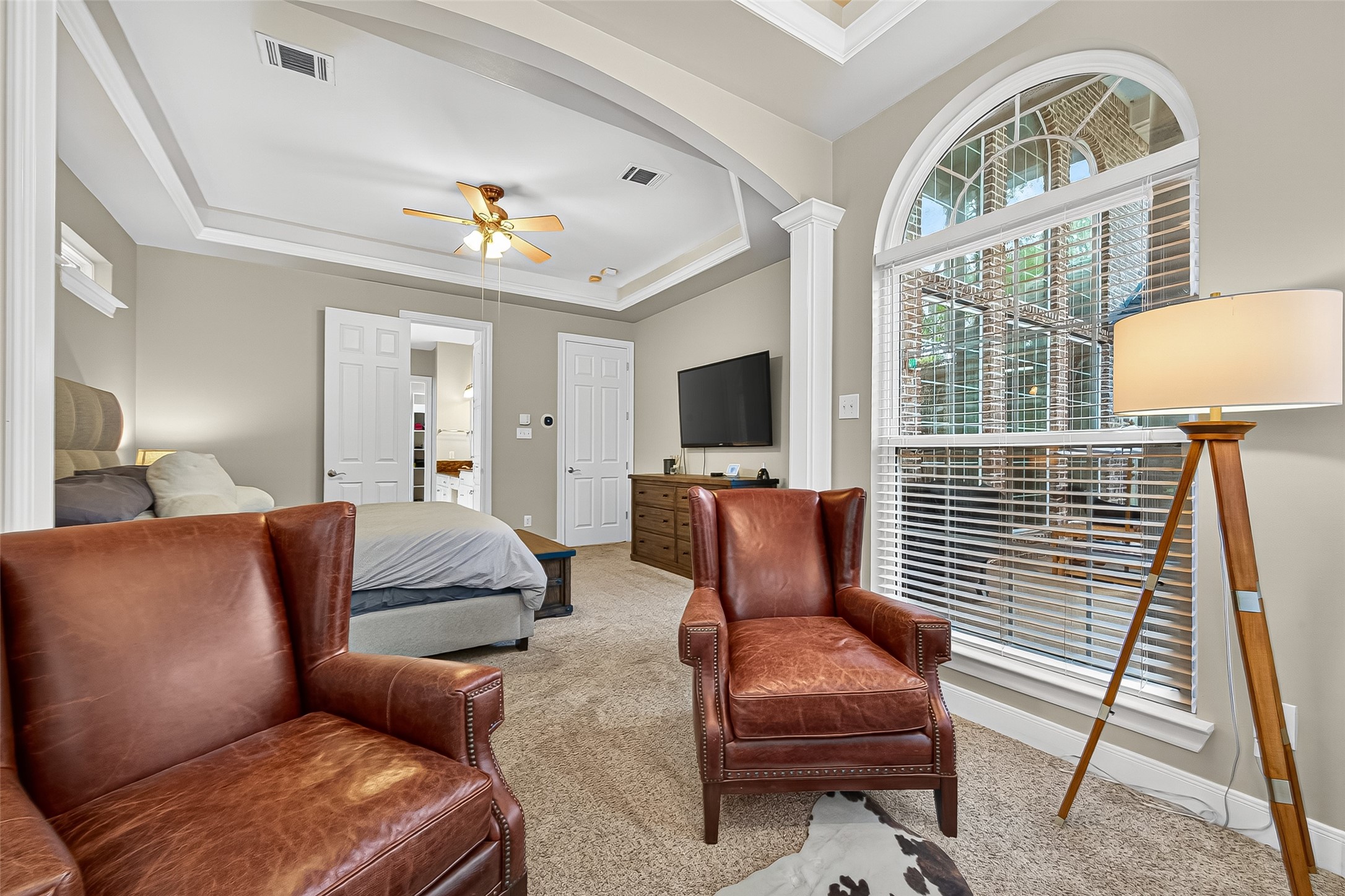 32819 Whitburn Trail Fulshear, TX 77441 - Photo 19 of 49 a living room with furniture a flat screen tv and a fireplace