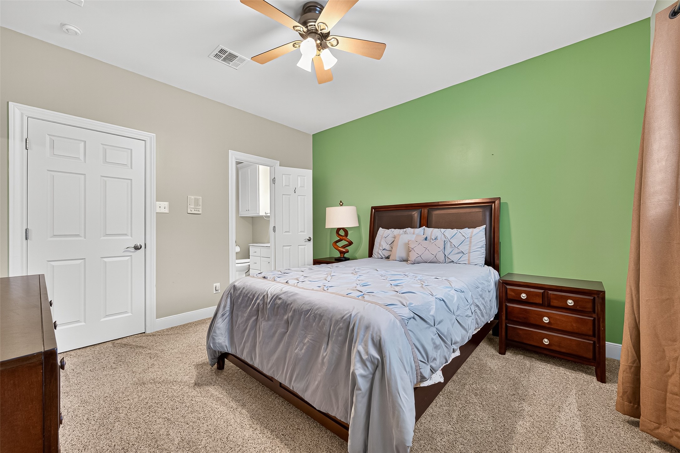 32819 Whitburn Trail Fulshear, TX 77441 - Photo 27 of 49 a bedroom with a bed and a chandelier