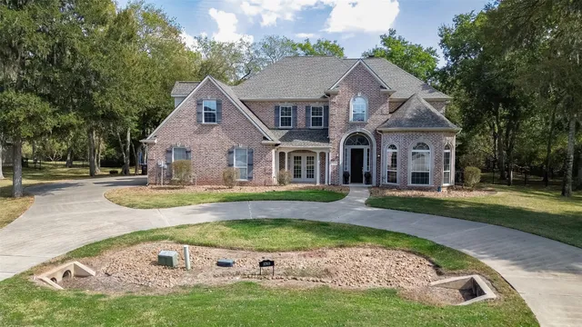 a view of house with garden space and swimming pool
