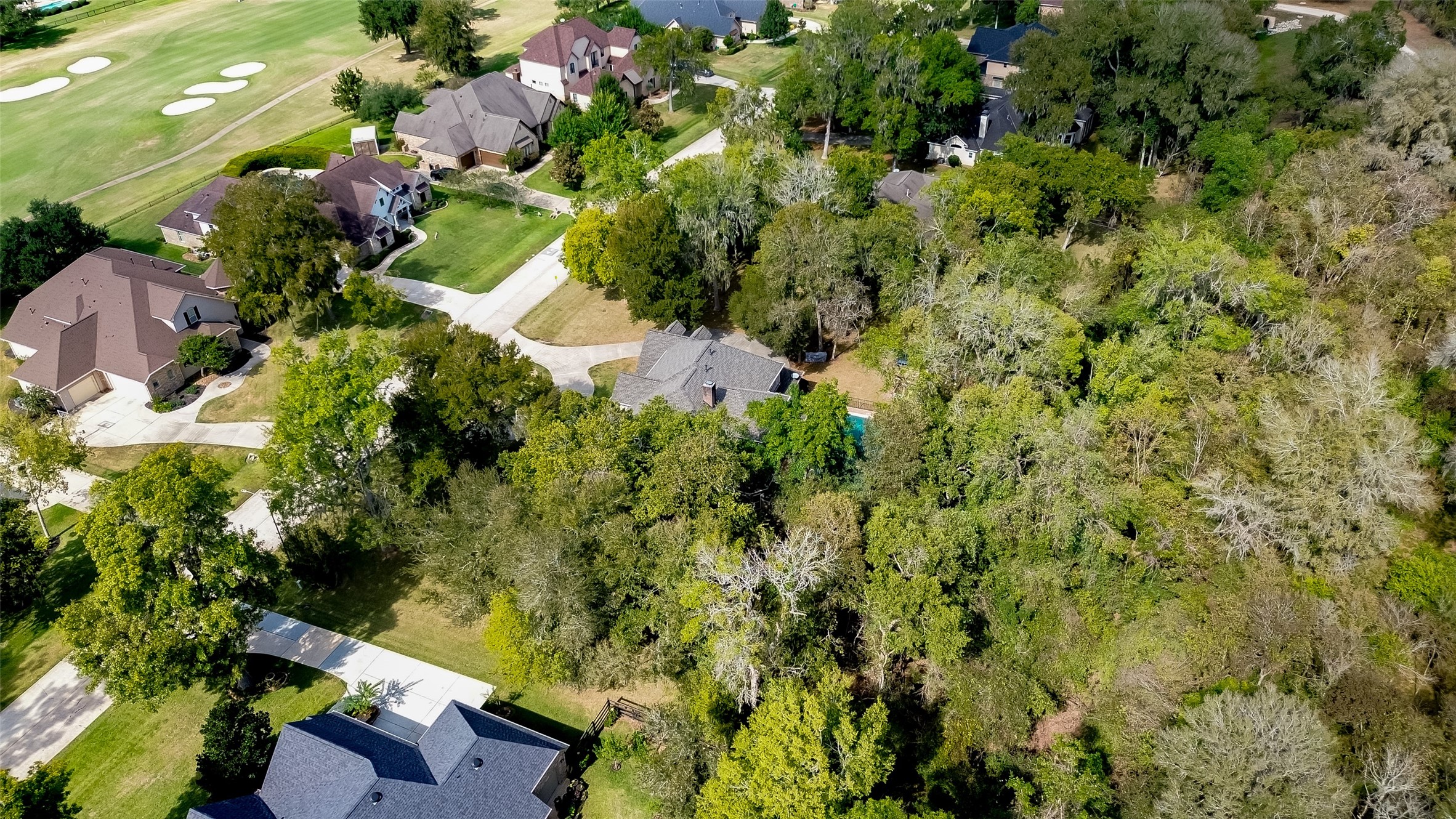32819 Whitburn Trail Fulshear, TX 77441 - Photo 40 of 49 an aerial view of residential house with outdoor space and trees all around